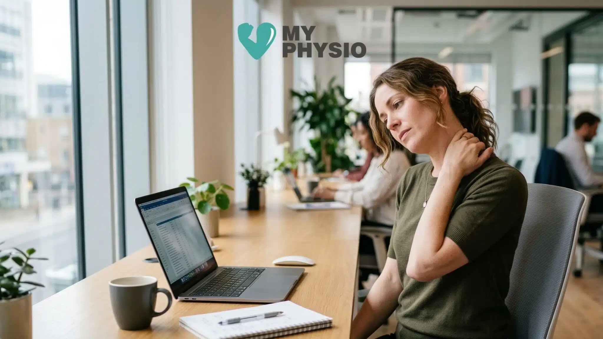 Office worker experiencing neck pain while sitting at a desk and using a laptop, illustrating a common posture-related condition treated by physiotherapy